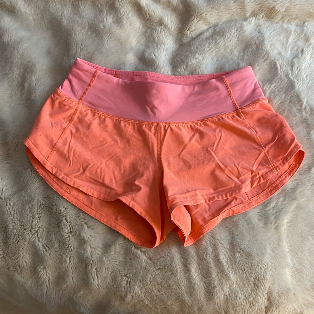 Neon pink Lululemon shorts; lightly used in great condition